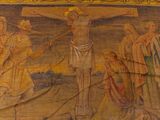 a painting of jesus on the cross on the wall