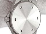 a close up of a person holding a watch in their hand