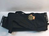 a black bag with a green logo on it