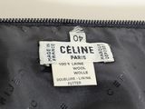 the label of a black jacket with a white cross on it