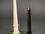 a pair of obelisk and obelisk on a pedestal