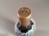 a close up of a bottle of wine on a table