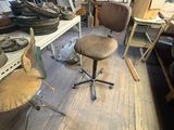 a chair that is sitting in the middle of a room
