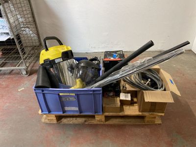 a blue box with tools in it sitting on a pallet