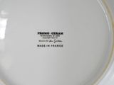 a white plate with black writing on it that says made in france