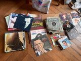 a lot of records on the floor of a room