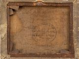 an old picture of a wooden frame with a sign on it