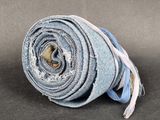 a rolled up rolled up piece of fabric on a table