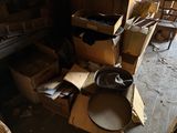 a pile of boxes and boxes on the floor in a room