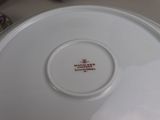 a white plate with a red and white design on it