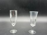 two empty wine glasses sitting on a table