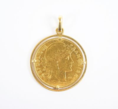 a close up of a gold coin on a white surface