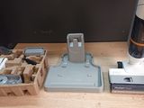 a vacuum that is sitting on a table next to other items
