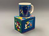 disney mickey mouse mug on top of a small box