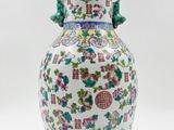 an image of a vase with flowers and birds on it