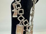 a bracelet that has a clock on it on a mannequin