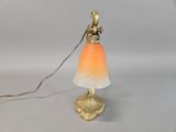a small lamp that is on a table with a cord