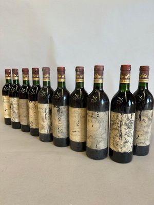 six bottles of wine are lined up in a row on a table