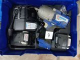 a blue box with tools inside of it on the floor