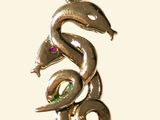 a snake that is sitting on top of a necklace