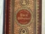 un vieux livre posé sur une table recouverte d'une nappe blanche