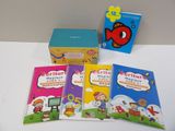 four children ' s books are sitting on a table next to a box