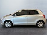 a picture of a small silver car parked in a garage