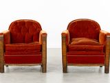pair of orange velvet club chairs with wood legs