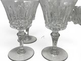 two wine glasses sitting next to each other on a table