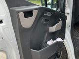 the door of a white truck with the driver ' s side door open