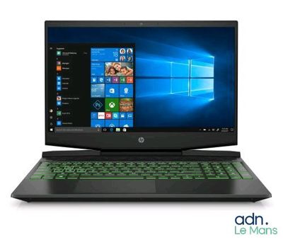 un ordinateur portable sur lequel est posé un clavier vert