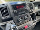 a dashboard of a truck with a clock on it