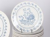 many plates stacked on top of each other on a table