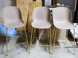 three chairs sitting next to each other in a room