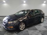 a picture of a black car parked in a garage