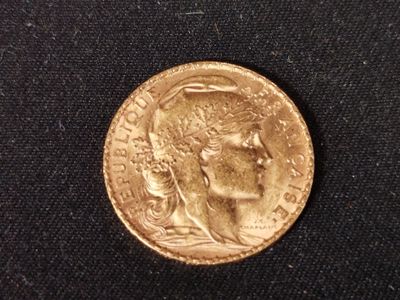 an image of a gold coin with a woman ' s head on it