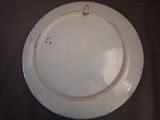 a white plate that has a hook on it