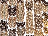 a lot of butterflies that are on display in a box