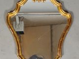 a mirror hanging on the wall in a room
