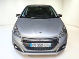 a silver car that is parked in a white room