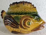 a ceramic fish shaped container on a table