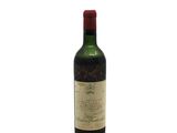 a bottle of wine that is sitting on a table
