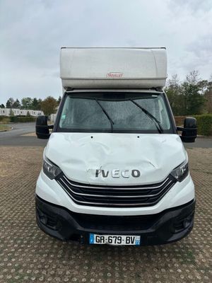 the white van is parked on the side of the road