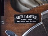 a close up of a label on a wooden object