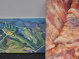 four paintings of different colors and sizes on the wall
