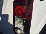 a close up of the tail light of a white truck