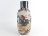 a vase with a picture of a man and a woman on it