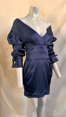 an image of a mannequin wearing a blue dress