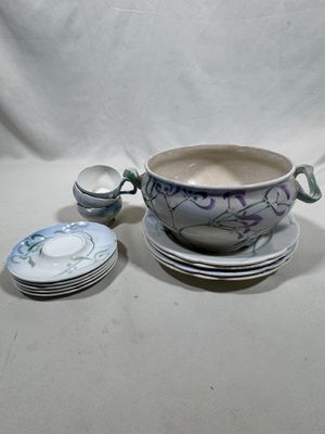 a bowl and a plate with a spoon on a table