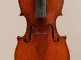 an old violin with a bow hanging from it ' s back